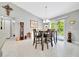 Dining area featuring modern table and chairs, with sliding door access to the patio at 1133 Nw 122Nd Pl, Citra, FL 32113