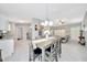 Dining and living areas offering an open layout, bright tile floors and modern finishes at 1133 Nw 122Nd Pl, Citra, FL 32113