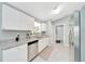 Bright kitchen showcases white cabinets, granite countertops and stainless steel appliances at 1133 Nw 122Nd Pl, Citra, FL 32113