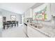Kitchen with granite countertops, stainless steel appliances, and adjacent dining space at 1133 Nw 122Nd Pl, Citra, FL 32113
