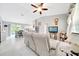 Open-concept living area with views of the dining room, kitchen, and sliding glass doors at 1133 Nw 122Nd Pl, Citra, FL 32113