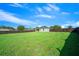 Vast backyard enclosed by a dark wooden fence, providing a secure and private outdoor space at 11330 Sw 61St Cir, Ocala, FL 34476
