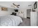 Bedroom with a ceiling fan, work space, and neutral decor, offering a serene retreat at 11330 Sw 61St Cir, Ocala, FL 34476
