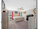 Primary bedroom with neutral tones, plush carpet, and a ceiling fan for added comfort at 11330 Sw 61St Cir, Ocala, FL 34476