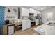 Stylish kitchen featuring white cabinets, stainless steel appliances, and modern decor elements at 11330 Sw 61St Cir, Ocala, FL 34476