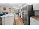 Sleek kitchen featuring modern appliances, white cabinetry, and an open layout perfect for entertaining at 11330 Sw 61St Cir, Ocala, FL 34476