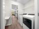 Convenient laundry room featuring modern appliances and providing easy access to the kitchen at 11330 Sw 61St Cir, Ocala, FL 34476