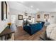 Spacious living room with comfortable seating, contemporary decor, and seamless flow to other living areas at 11330 Sw 61St Cir, Ocala, FL 34476