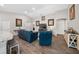 Comfortable living room space offering a cozy spot for relaxation and seamless entryways to other spaces at 11330 Sw 61St Cir, Ocala, FL 34476