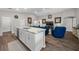 Living room view highlighting the open-concept layout and granite countertops at 11330 Sw 61St Cir, Ocala, FL 34476