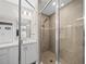 Shower room featuring sleek fixtures, glass doors, and contemporary tile design at 11330 Sw 61St Cir, Ocala, FL 34476