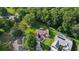 Wide angle aerial view displaying lush landscape with home featuring solar panels and manicured lawn at 11598 Sw 74Th Ct, Ocala, FL 34476