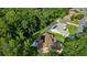 Bird's eye view showcasing a home with solar panels, green lawn, and the pool at 11598 Sw 74Th Ct, Ocala, FL 34476