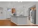 Bright kitchen with a breakfast bar, modern appliances, and an adjacent dining area featuring natural light at 11598 Sw 74Th Ct, Ocala, FL 34476