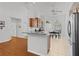 Bright, modern kitchen with a breakfast bar overlooking the dining area and stainless steel appliances at 11598 Sw 74Th Ct, Ocala, FL 34476