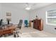 Bright home office with natural light, tile flooring and a desk setup at 11598 Sw 74Th Ct, Ocala, FL 34476