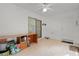 Enclosed porch features tile floors, ceiling fan, desk and private entry to the exterior at 11598 Sw 74Th Ct, Ocala, FL 34476