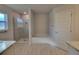 Bright bathroom features a tile shower, soaking tub, and neutral color scheme at 12384 Sw 96Th Ln, Dunnellon, FL 34432