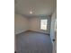 This comfortable bedroom features neutral paint and large windows for natural light at 12384 Sw 96Th Ln, Dunnellon, FL 34432