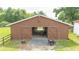 Open barn structure with sliding doors and ample space, perfect for storage and livestock at 1501 Ne 97Th Street Rd, Anthony, FL 32617