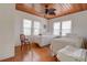 Bright bedroom with two beds, wood ceiling, and ample natural light from windows at 1501 Ne 97Th Street Rd, Anthony, FL 32617
