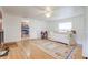 Bedroom with light walls, wood floors, access to the kitchen, and a bright window at 1501 Ne 97Th Street Rd, Anthony, FL 32617