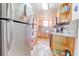Kitchen featuring stainless steel appliances, wooden cabinetry, granite countertops and decorative tile backsplash at 1501 Ne 97Th Street Rd, Anthony, FL 32617