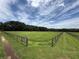 Fenced pasture under a bright sky at 1501 Ne 97Th Street Rd, Anthony, FL 32617