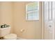 Bright bathroom with toilet and linen closet maximize functionality in this practical space at 1689 Ne 161St Pl, Citra, FL 32113