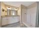 Bright bathroom with double sinks, granite counters, and walk-in shower create a spa-like retreat at 1689 Ne 161St Pl, Citra, FL 32113