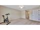 Spacious bedroom with neutral tones, ceiling fan, carpet floors, and connected bathroom for convenience at 1689 Ne 161St Pl, Citra, FL 32113