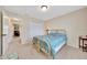 Comfortable bedroom featuring a queen bed, and bright lighting, perfect for a restful and relaxing sleep at 1689 Ne 161St Pl, Citra, FL 32113