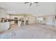 Open-concept layout with modern stainless steel appliances, tiled floor and kitchen island, connecting to the living room at 1689 Ne 161St Pl, Citra, FL 32113