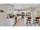 Well-lit kitchen featuring granite countertops, stainless steel appliances, white cabinetry and eat-in breakfast bar at 1689 Ne 161St Pl, Citra, FL 32113