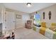 Comfortable living room with soft seating and large window, perfect for relaxation and easy living at 1689 Ne 161St Pl, Citra, FL 32113