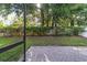 Landscaped backyard features a brick patio, lush lawn, and privacy fence, offering a serene outdoor living space at 2127 Ne 38Th Ter, Ocala, FL 34470