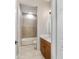 Bright bathroom showcasing a wood vanity, white countertop and combination tub shower at 2127 Ne 38Th Ter, Ocala, FL 34470