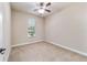 Bedroom with neutral walls, carpet, and ceiling fan at 2127 Ne 38Th Ter, Ocala, FL 34470