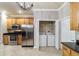 Kitchen with stainless steel appliances and a washer and dryer closet at 2127 Ne 38Th Ter, Ocala, FL 34470