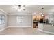 Open-concept living room with tile flooring, ceiling fan, and windows for ample natural light at 2127 Ne 38Th Ter, Ocala, FL 34470