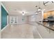 Spacious living room with tile flooring, stylish lighting, and glass doors to the outside at 2127 Ne 38Th Ter, Ocala, FL 34470