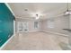 Bright living room with tile flooring, a ceiling fan, and French doors leading to the outdoor space at 2127 Ne 38Th Ter, Ocala, FL 34470