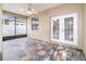 Enclosed patio with neutral walls, slate-look tile floor and French doors at 2127 Ne 38Th Ter, Ocala, FL 34470