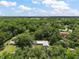 Aerial view of property, showcasing its spacious lot and wooded surroundings at 2155 Nw 27Th Ave, Ocala, FL 34475