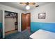 Bedroom Closet featuring blue and white walls, hanging storage with door open to hallway at 2155 Nw 27Th Ave, Ocala, FL 34475