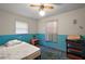 Bedroom with two tone paint, and window with curtain, a ceiling fan and bedside table at 2155 Nw 27Th Ave, Ocala, FL 34475