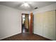 This bedroom features hardwood floors, a ceiling fan, and a closet, offering comfort and functionality at 2155 Nw 27Th Ave, Ocala, FL 34475