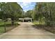 Charming one-story home, featuring a spacious driveway, covered carport and fenced yard at 2155 Nw 27Th Ave, Ocala, FL 34475