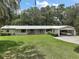 Charming single story house with brick detail, large front yard and carport at 2155 Nw 27Th Ave, Ocala, FL 34475
