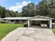 Charming one-story home featuring brick accents and a covered carport at 2155 Nw 27Th Ave, Ocala, FL 34475